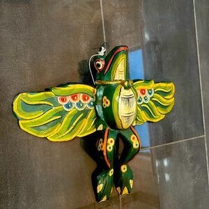 Ornate painted wooden vintage frog that hangs